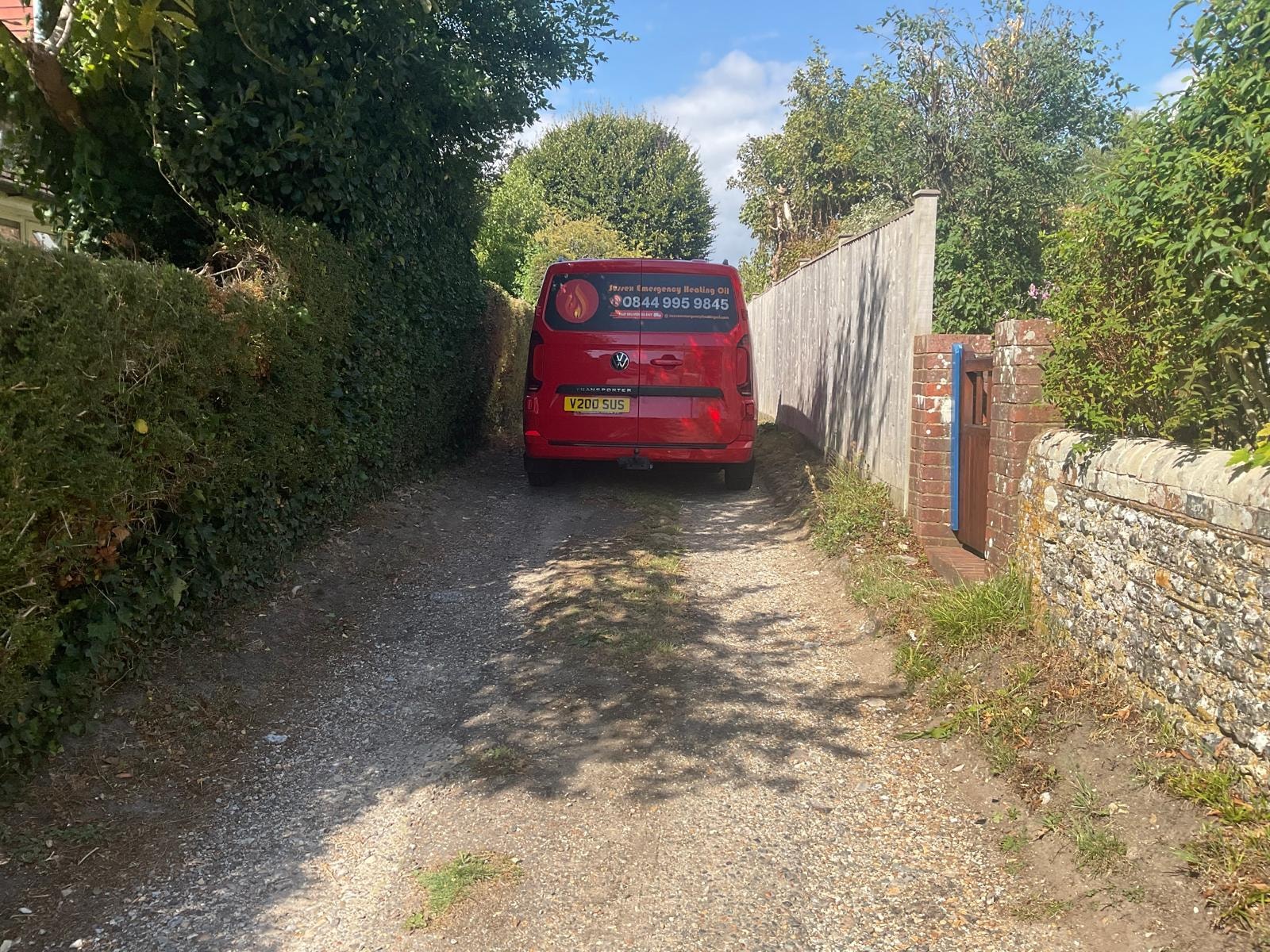 Sussex Emergency Heating Oil van making a delivery through narrow driveway access