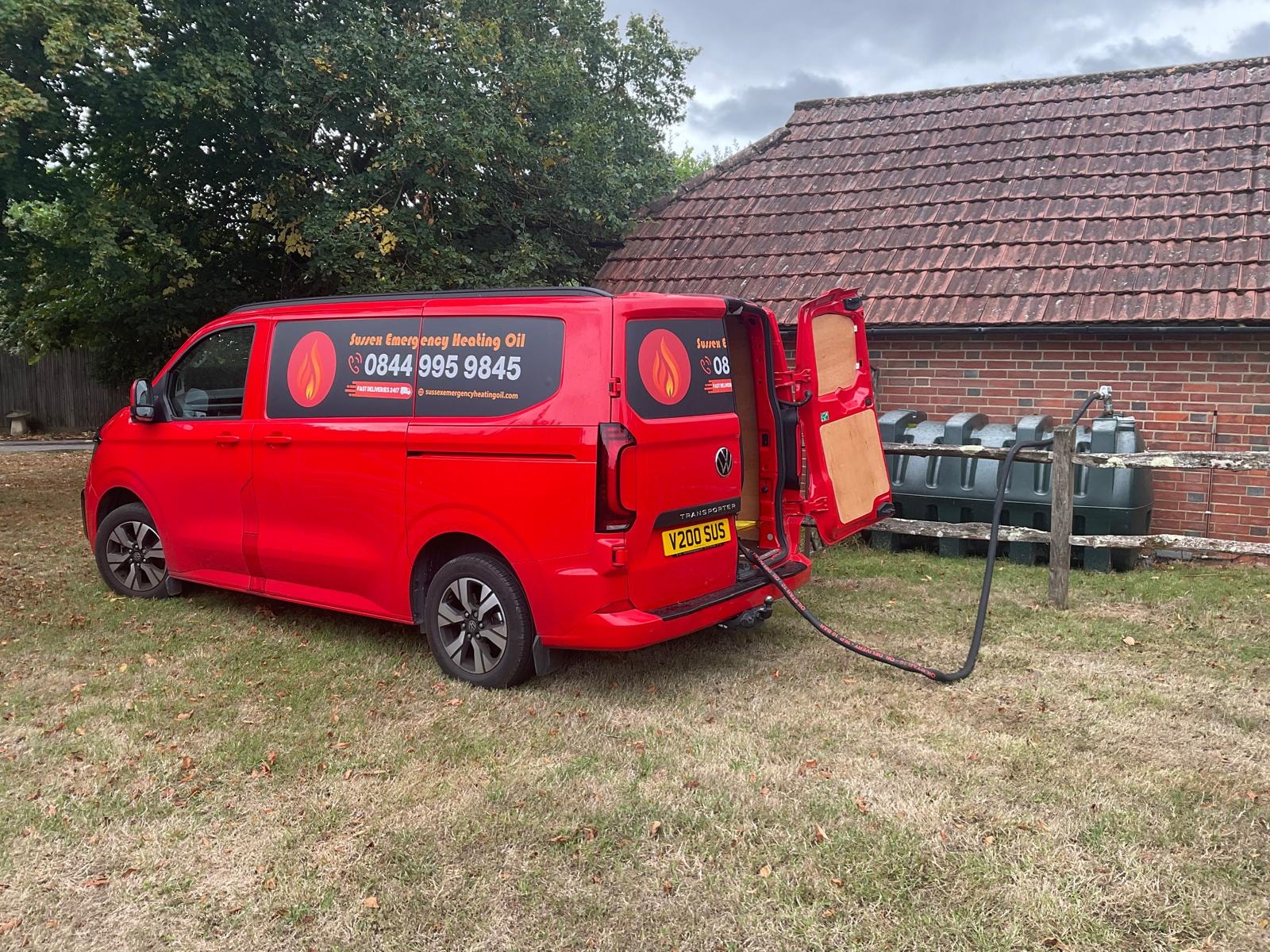 Sussex Emergency Heating Oil van delivering fuel to a home heating oil tank
